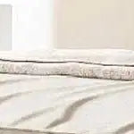 Letto a piattaforma imbottito con motivo a mattoni e letto estraibile Twin XL